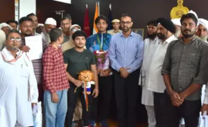 Group photo with awards and celebration.